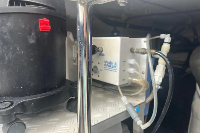 Slide: The Image of Engine room equipment on a 2018 Azimut 66 yacht, featuring a water filtration system. - 51