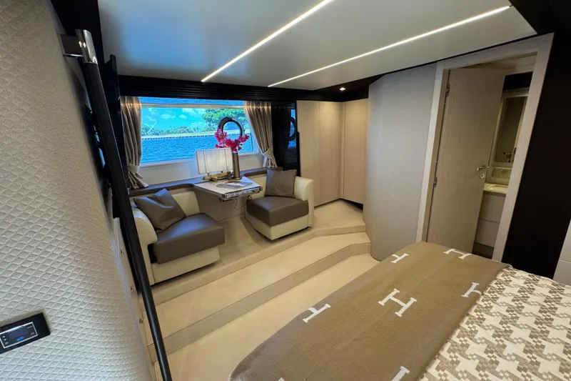 Slide: The Image of Luxurious interior of 2018 Azimut 66 Flybridge yacht with elegant seating and scenic window view. - 32