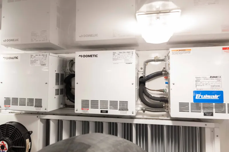 Slide: The Image of Dometic and Cruisair units in a 2012 Viking 76 Enclosed Bridge yacht engine room. - 119