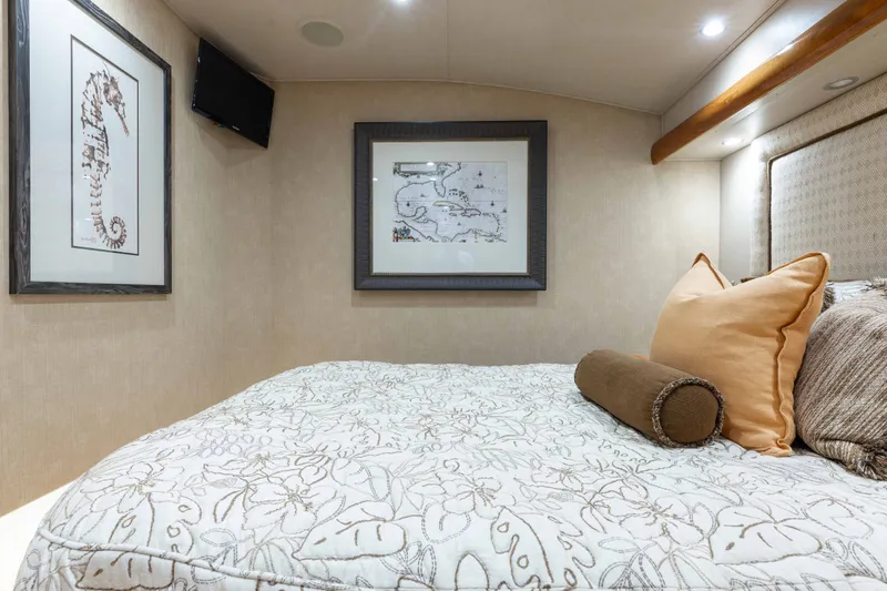 Slide: The Image of Luxurious bedroom interior of 2012 Viking 76 Enclosed Bridge yacht with elegant decor. - 89