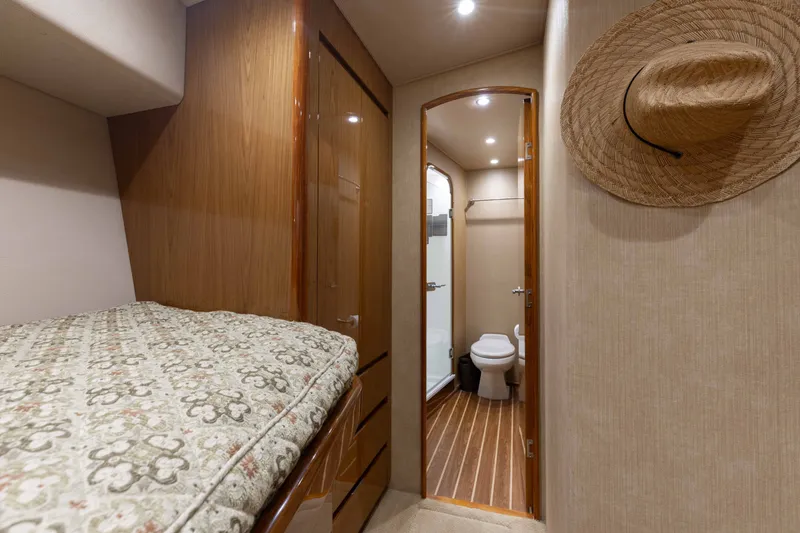 Slide: The Image of Interior of 2012 Viking 76 Enclosed Bridge yacht with cozy cabin and bathroom. - 96