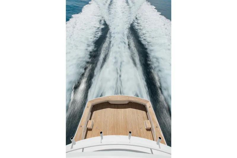 Slide: The Image of Aerial view of 2012 Viking 76 Enclosed Bridge yacht cruising, leaving a wake. - 19