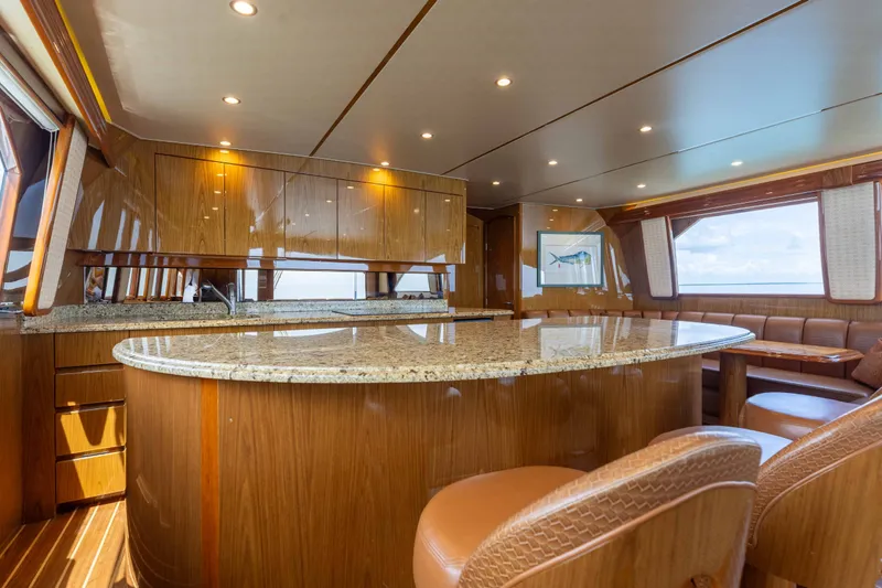 Slide: The Image of Luxurious interior of 2012 Viking 76 Enclosed Bridge yacht with elegant wood and granite finishes. - 70