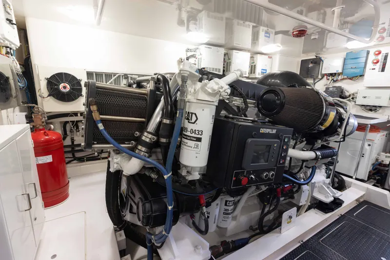 Slide: The Image of Engine room of 2012 Viking 76 Enclosed Bridge yacht, featuring Caterpillar machinery. - 109