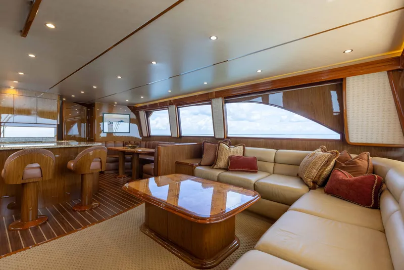 Slide: The Image of Luxurious interior of 2012 Viking 76 Enclosed Bridge yacht with plush seating and elegant decor. - 64