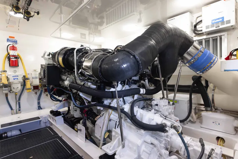 Slide: The Image of Engine room of a 2012 Viking 76 Enclosed Bridge yacht, showcasing machinery and equipment. - 105