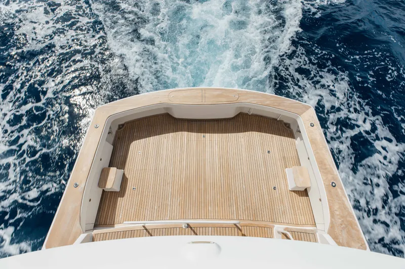 Slide: The Image of Aerial view of 2012 Viking 76 Enclosed Bridge yacht deck on open sea. - 22