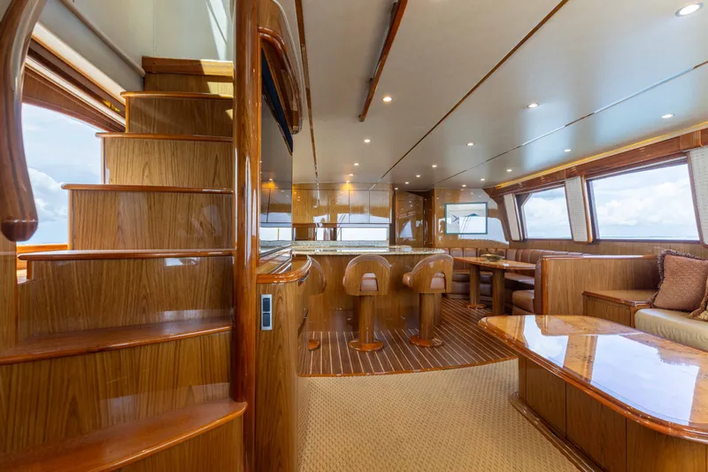 Slide: The Image of Luxurious interior of 2012 Viking 76 Enclosed Bridge yacht with elegant wood finishes. - 62