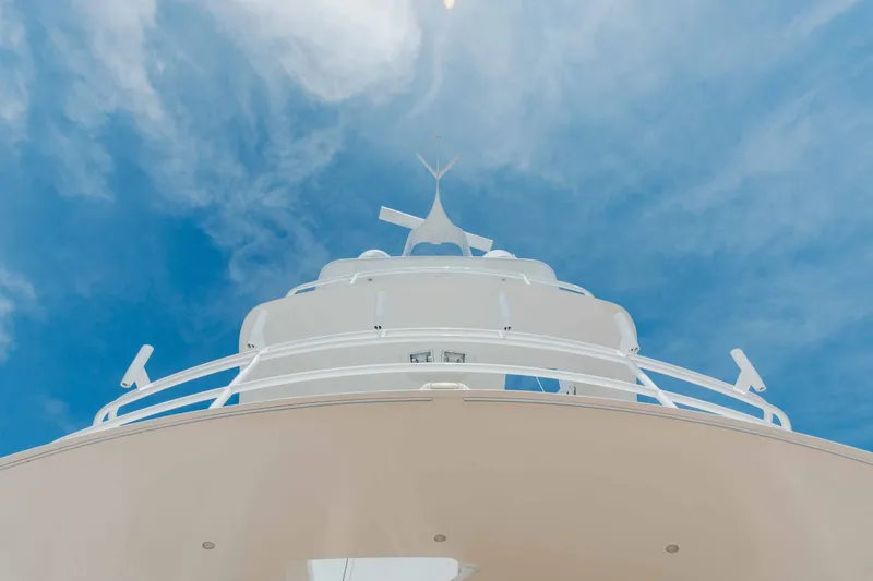 Slide: The Image of Low-angle view of 2012 Viking 76 Enclosed Bridge yacht against a clear blue sky. - 39