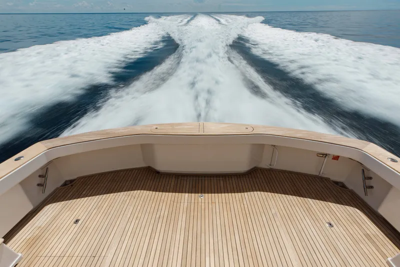 Slide: The Image of Viking 76 Enclosed Bridge 2012 yacht cruising, leaving a wake on open sea. - 25