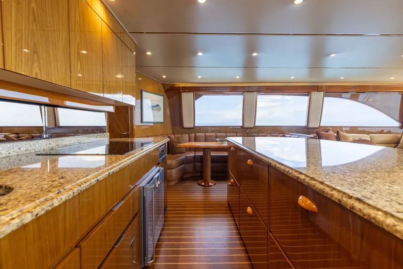 Slide: The Image of Luxurious interior of 2012 Viking 76 Enclosed Bridge yacht with elegant wood finishes. - 74