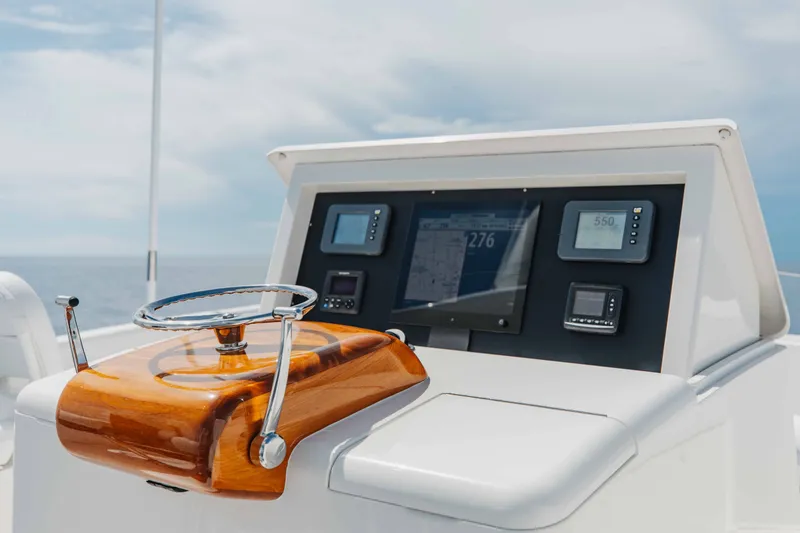 Slide: The Image of Control panel of 2012 Viking 76 Enclosed Bridge yacht with navigation displays. - 48