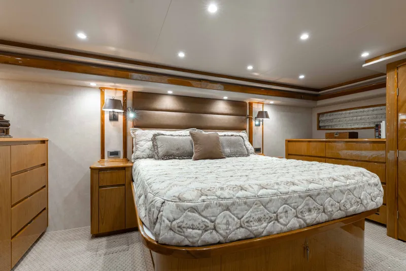 Slide: The Image of Luxurious bedroom interior of 2012 Viking 76 Enclosed Bridge yacht with elegant wood finishes. - 83