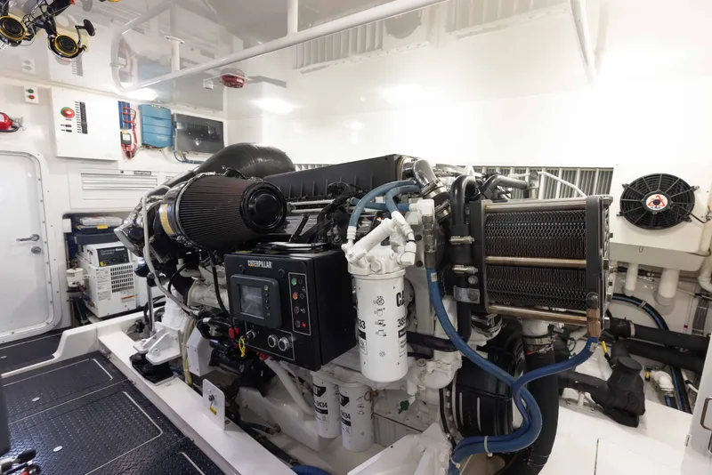 Slide: The Image of Engine room of 2012 Viking 76 Enclosed Bridge yacht, featuring Caterpillar machinery. - 108