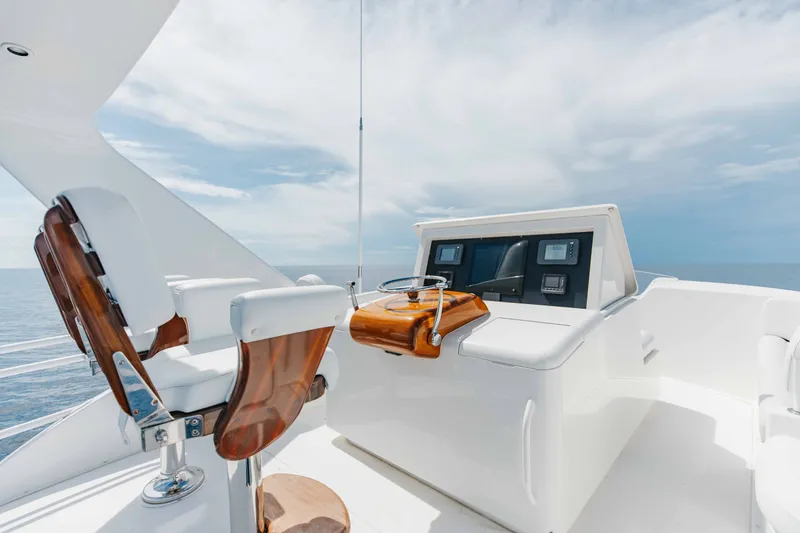 Slide: The Image of Luxury helm of 2012 Viking 76 Enclosed Bridge yacht with ocean view. - 47