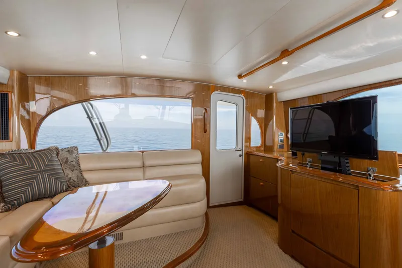 Slide: The Image of Luxurious interior of 2012 Viking 76 Enclosed Bridge yacht with ocean view. - 52
