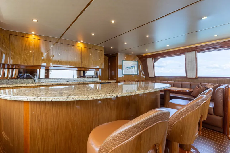 Slide: The Image of Luxurious interior of 2012 Viking 76 Enclosed Bridge yacht with elegant wood and granite finishes. - 71