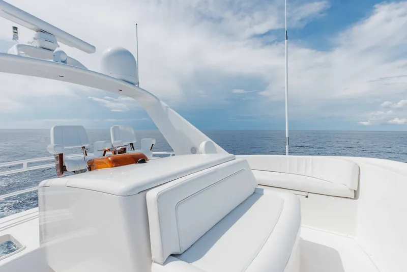Slide: The Image of Luxurious 2012 Viking 76 Enclosed Bridge yacht deck with ocean view and seating. - 42