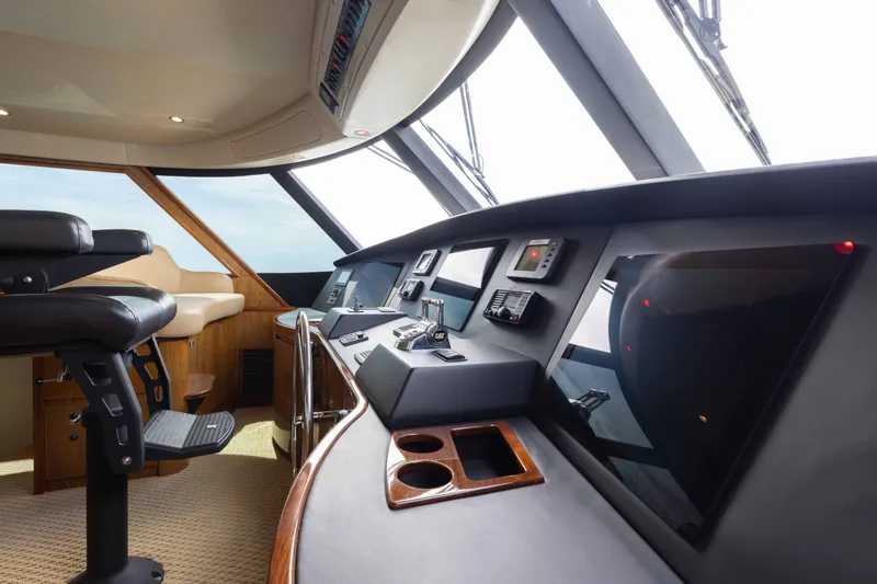 Slide: The Image of Interior of 2012 Viking 76 Enclosed Bridge yacht cockpit with modern navigation equipment. - 59