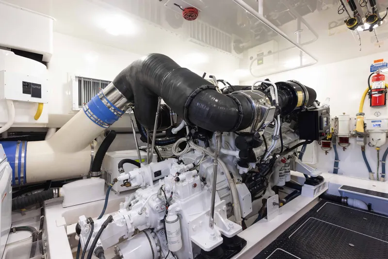 Slide: The Image of Engine room of 2012 Viking 76 Enclosed Bridge yacht, showcasing advanced machinery and equipment. - 106