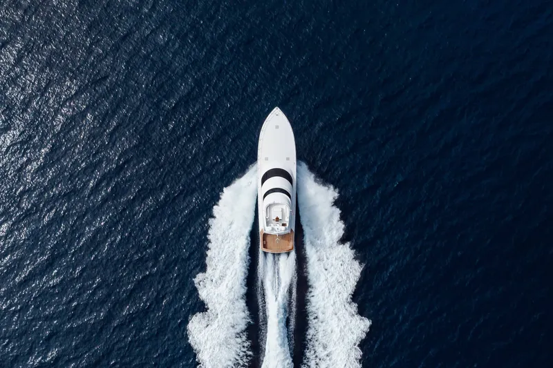 Slide: The Image of Aerial view of 2012 Viking 76 Enclosed Bridge yacht cruising on open sea. - 15