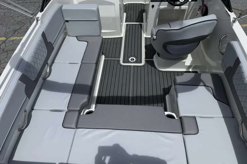 Slide: The Image of 2026 Bayliner VR4 Bowrider OB interior with gray seating and modern design. - 3
