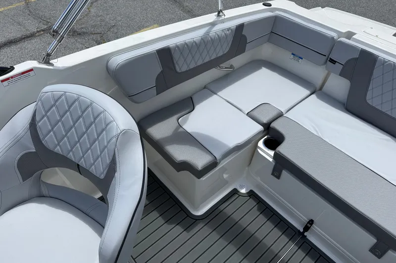 Slide: The Image of 2026 Bayliner VR4 Bowrider OB interior with gray cushioned seating and modern design. - 6