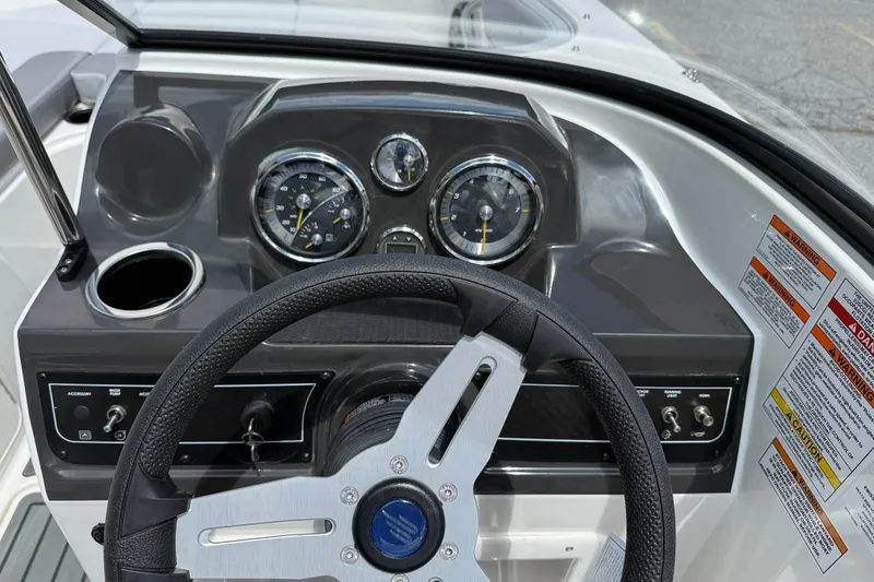 Slide: The Image of Dashboard of 2026 Bayliner VR4 Bowrider OB with steering wheel and gauges. - 7