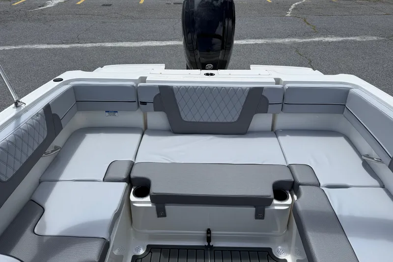 Slide: The Image of 2026 Bayliner VR4 Bowrider OB interior with gray seating and cup holders. - 5
