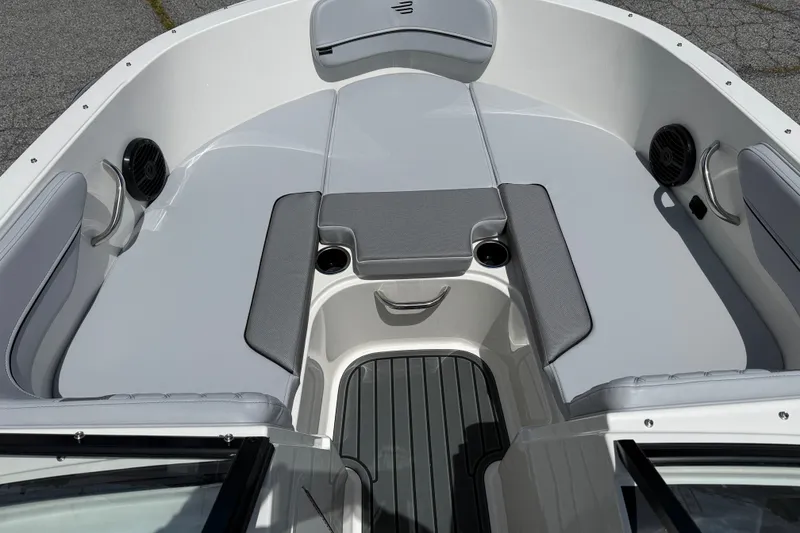 Slide: The Image of 2026 Bayliner VR4 Bowrider OB interior with gray seating and cup holders. - 8