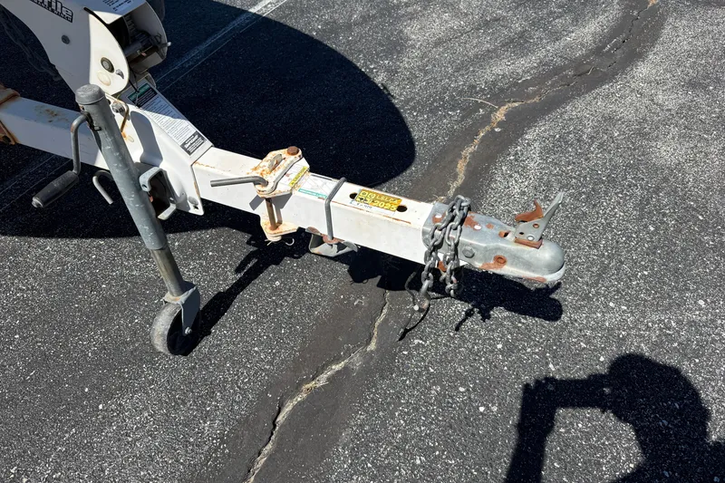 Slide: The Image of Trailer hitch of a 2000 Sea Ray 180 Bow Rider on asphalt surface. - 20