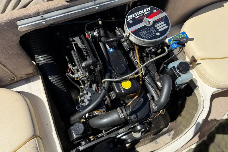 Slide: The Image of Engine of a 2000 Sea Ray 180 Bow Rider boat, featuring a MerCruiser motor. - 17