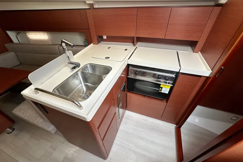 Slide: The Image of Modern kitchen interior of 2021 Hanse 348 yacht with sink and stove. - 27