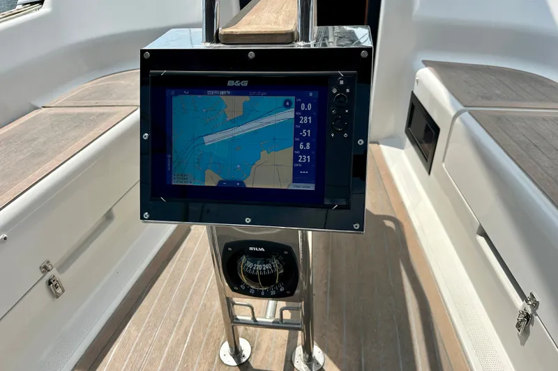Slide: The Image of Navigation system and compass on 2021 Hanse 348 yacht deck. - 12
