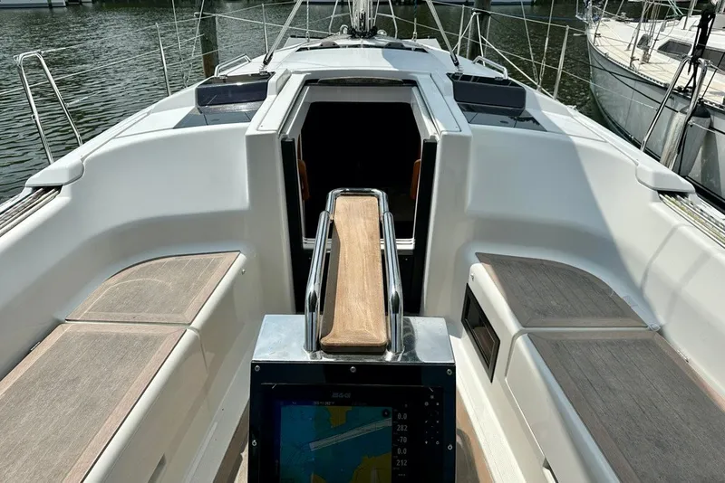 Slide: The Image of 2021 Hanse 348 yacht cockpit with navigation display and seating. - 11