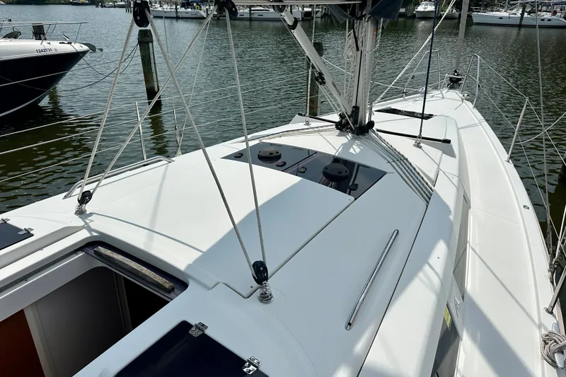 Slide: The Image of 2021 Hanse 348 sailboat deck view, docked in a marina. - 16
