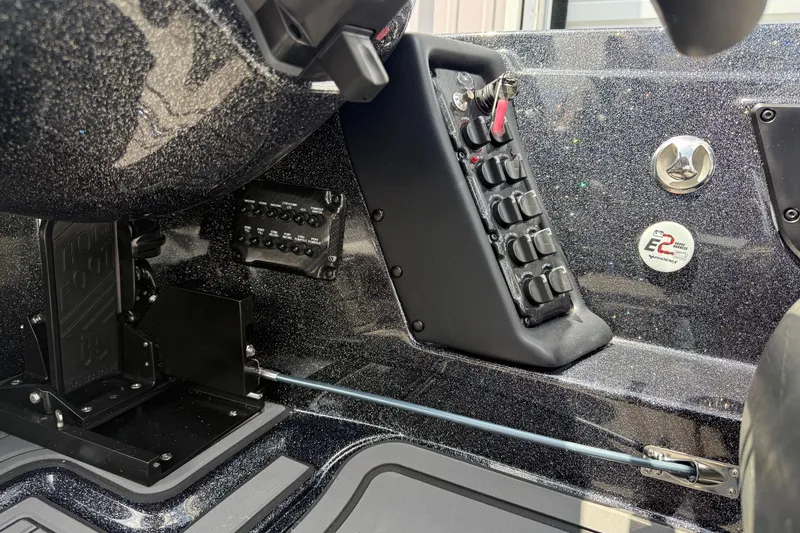 Slide: The Image of Control panel of 2027 Phoenix 721 ZXL boat with switches and metallic finish. - 13