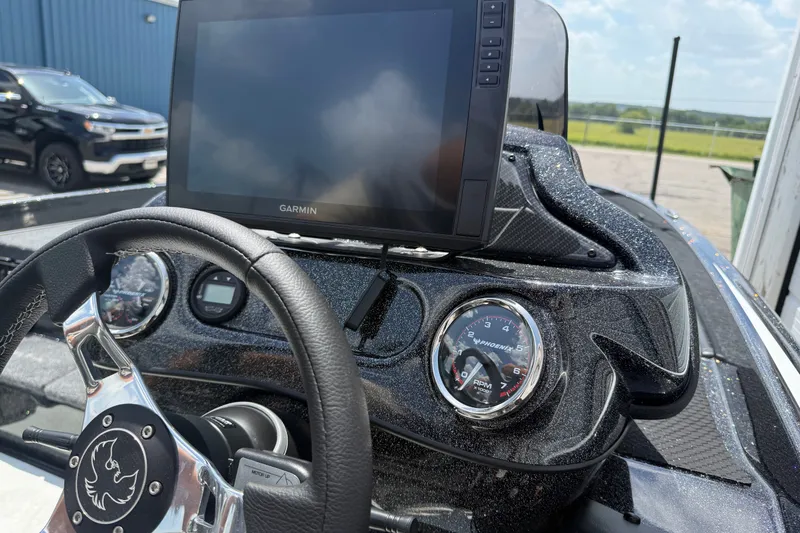 Slide: The Image of Dashboard of a 2027 Phoenix 721 ZXL boat with Garmin display and gauges. - 17