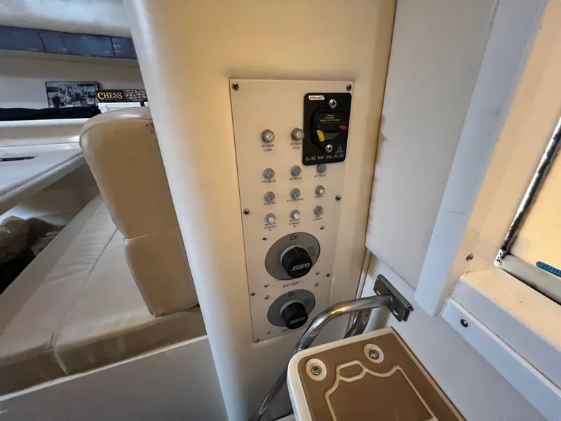 Slide: The Image of Interior view of a 2004 Wellcraft 330 Coastal with control panel and seating area. - 13