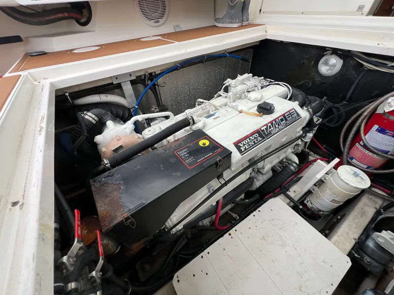 Slide: The Image of The engine compartment of a 2004 Wellcraft 330 Coastal features a Volvo Penta engine. - 18