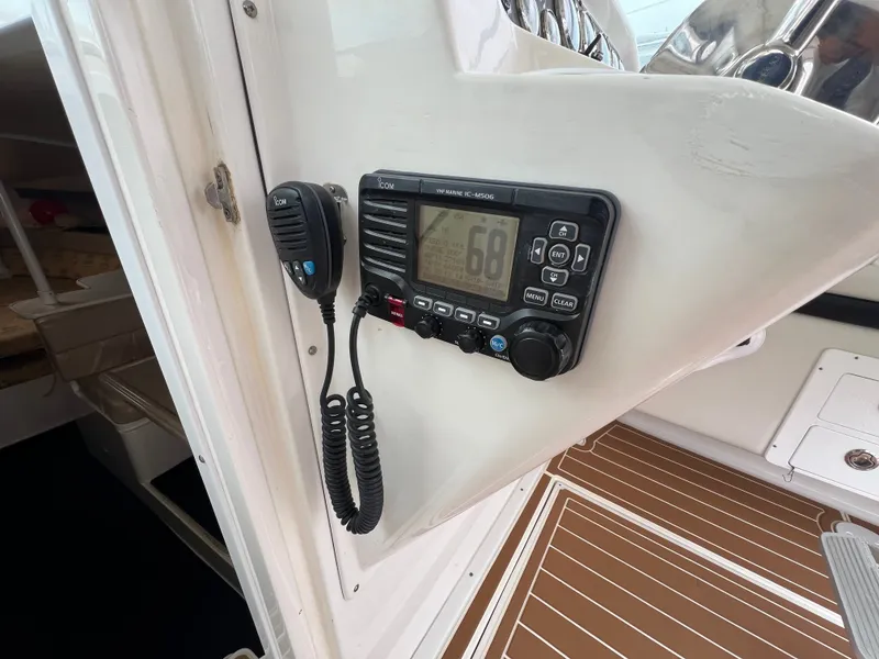Slide: The Image of A marine radio is mounted on the helm of a 2004 Wellcraft 330 Coastal. - 7