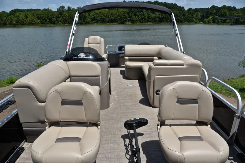 Slide: The Image of 2022 Sun Tracker Fishin' Barge 20 DLX pontoon boat on a serene lake. - 20