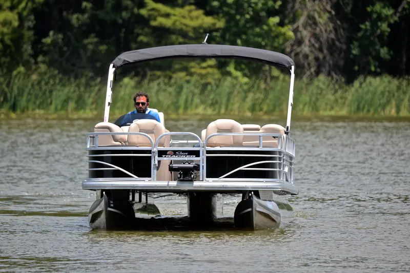 Slide: The Image of 2022 Sun Tracker Fishin' Barge 20 DLX pontoon boat on a serene lake. - 8