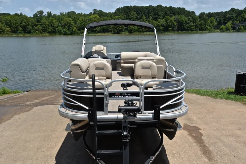 Slide: The Image of 2022 Sun Tracker Fishin' Barge 20 DLX pontoon boat by a scenic lake. - 17