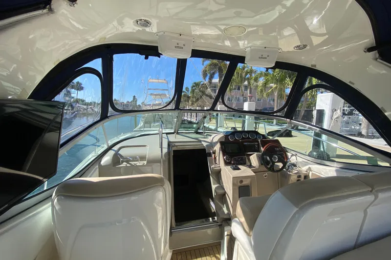 Slide: The Image of Interior view of 2008 Sea Ray Sundancer 330 yacht cockpit with steering and controls. - 30