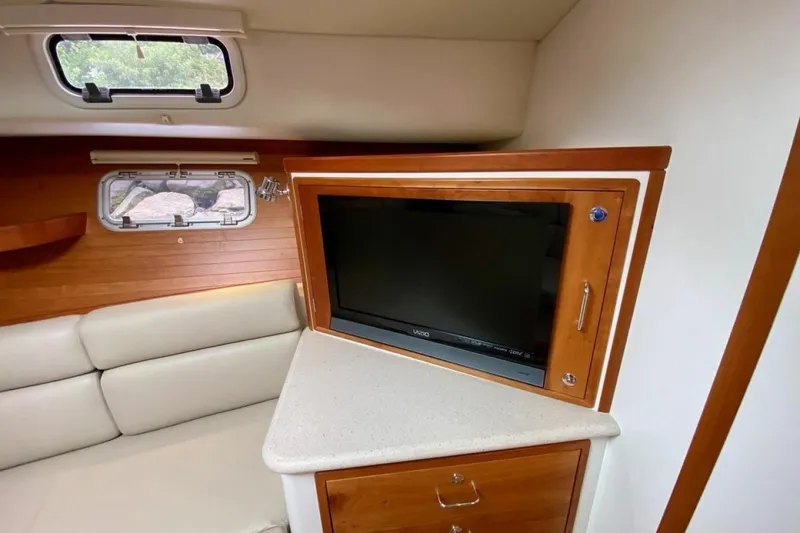 Slide: The Image of Interior of 2013 MJM 36z Downeast yacht with TV and wooden cabinetry. - 25
