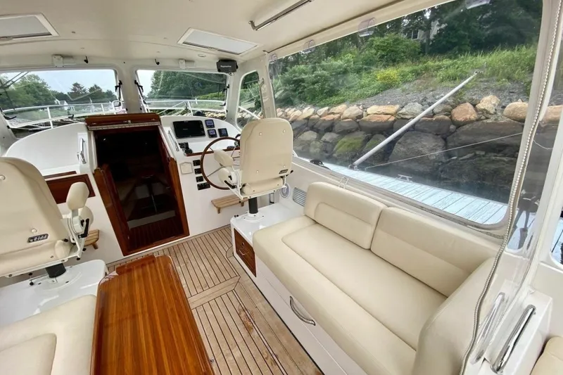 Slide: The Image of Interior of 2013 MJM 36z Downeast boat with elegant seating and steering area. - 15