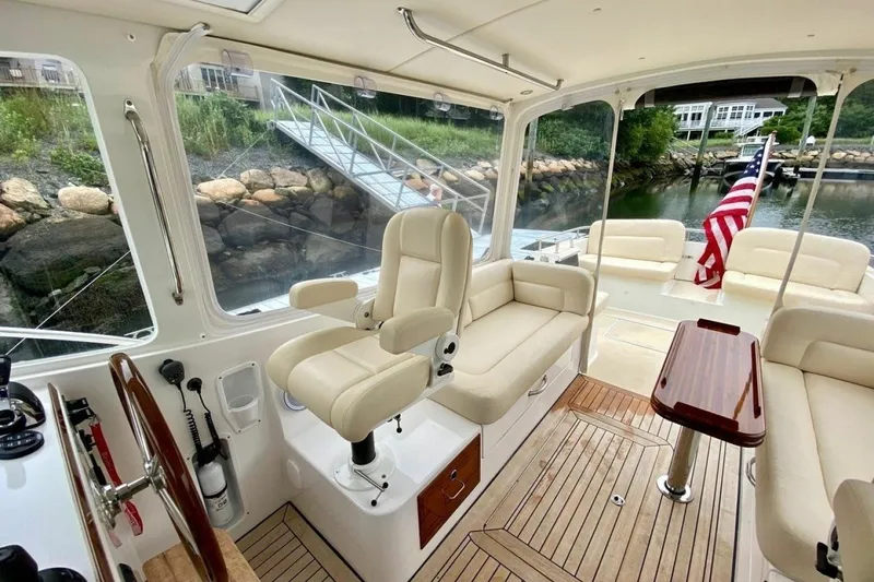 Slide: The Image of Interior of 2013 MJM 36z Downeast yacht with elegant seating and American flag. - 17