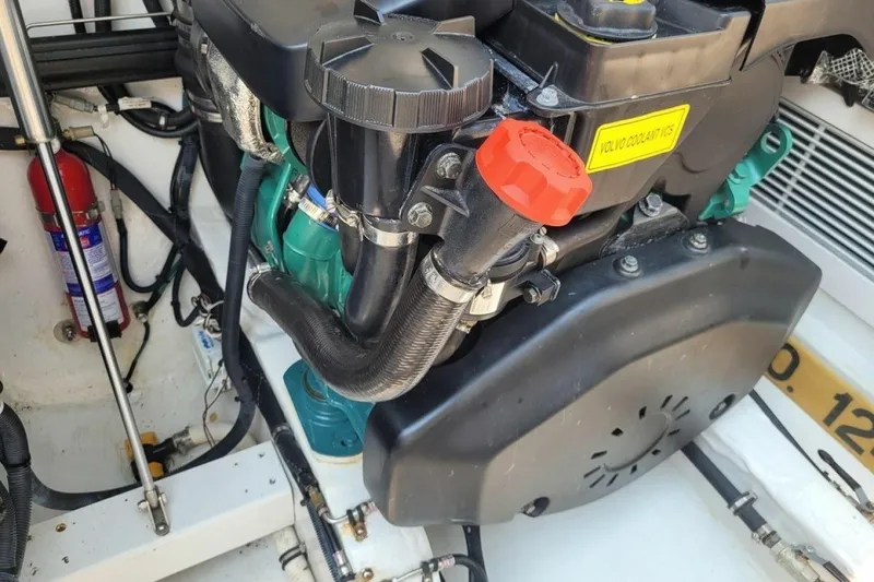Slide: The Image of Engine compartment of 2013 MJM 36z Downeast boat with visible Volvo coolant cap. - 33