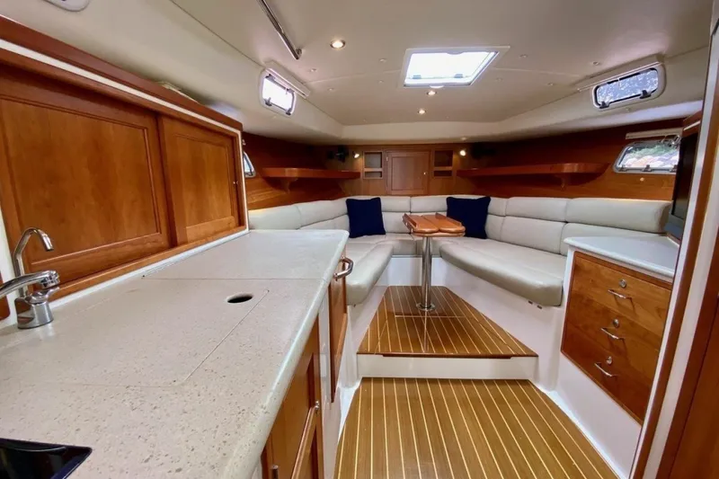 Slide: The Image of Luxurious interior of 2013 MJM 36z Downeast yacht with elegant wood finishes and cozy seating. - 18